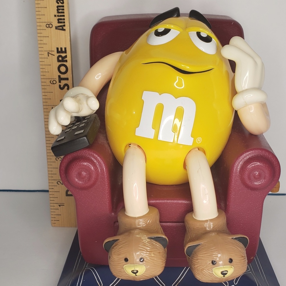 Yellow M&M on Maroon La-Z-Boy Dispenser
